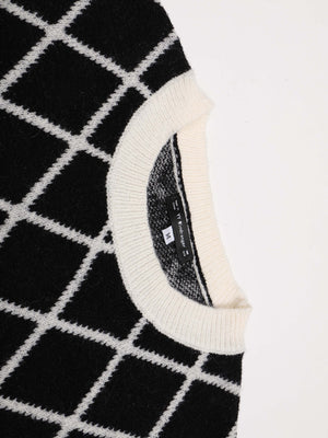 Maglione Donna con Motivo a Rombi e Maniche a Palloncino – Eleganza Grafica – Vittoria
