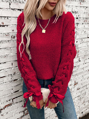 Maglione Invernale Donna – Elegante con Fiocchi sulle Maniche e Dettagli Intrecciati