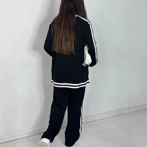 Completo Donna Sportivo con Maglia a Righe e Pantaloni a Gamba Larga – Stile Dinamico e Comfort – Nicole